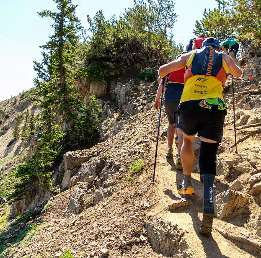 man hiking up a mountain