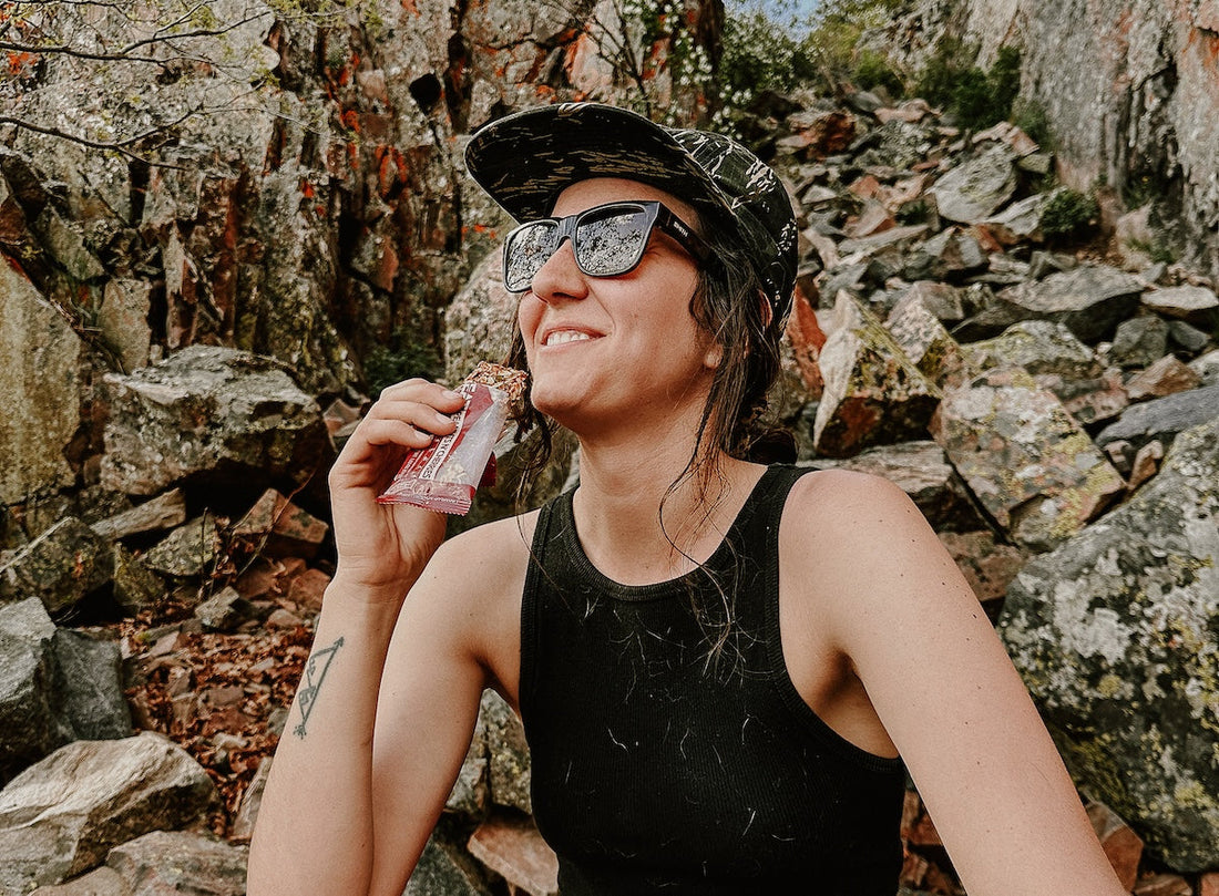 Woman eating bar u eat for good gut health
