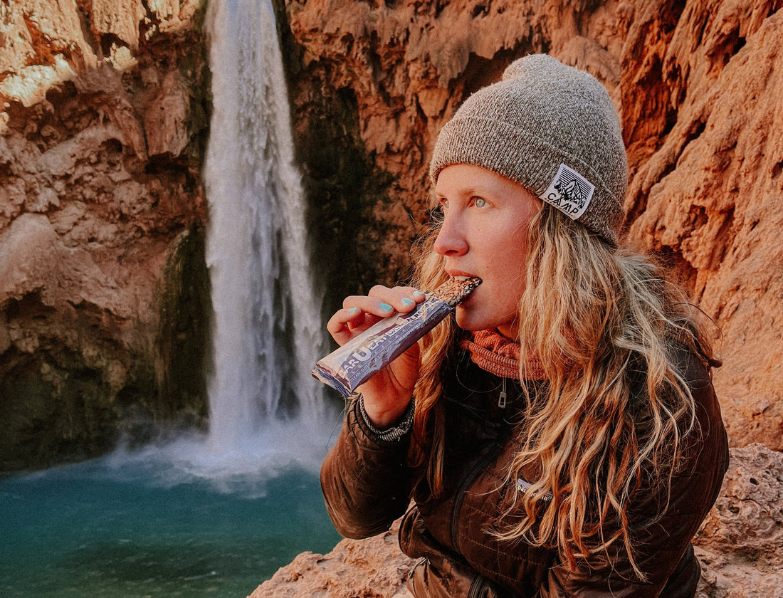woman eating bar u eat for longevity
