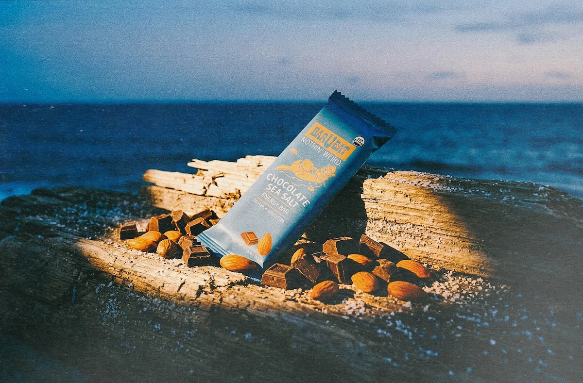 Chocolate bar u eat bar with chocolate and almonds on a rock by the ocean