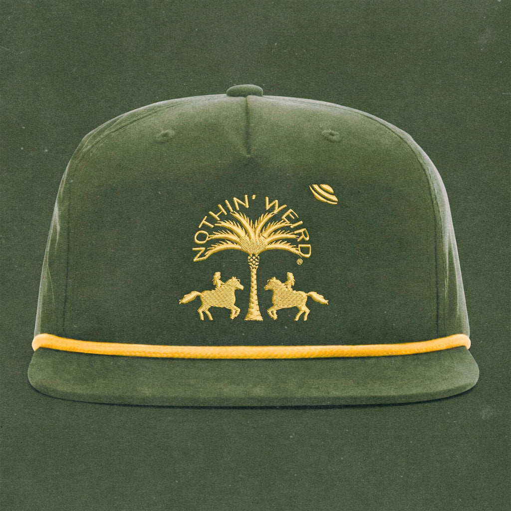 Green and gold ball cap with western horses, palm tree, and ufo stitched on it.