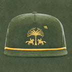 Green and gold ball cap with western horses, palm tree, and ufo stitched on it.