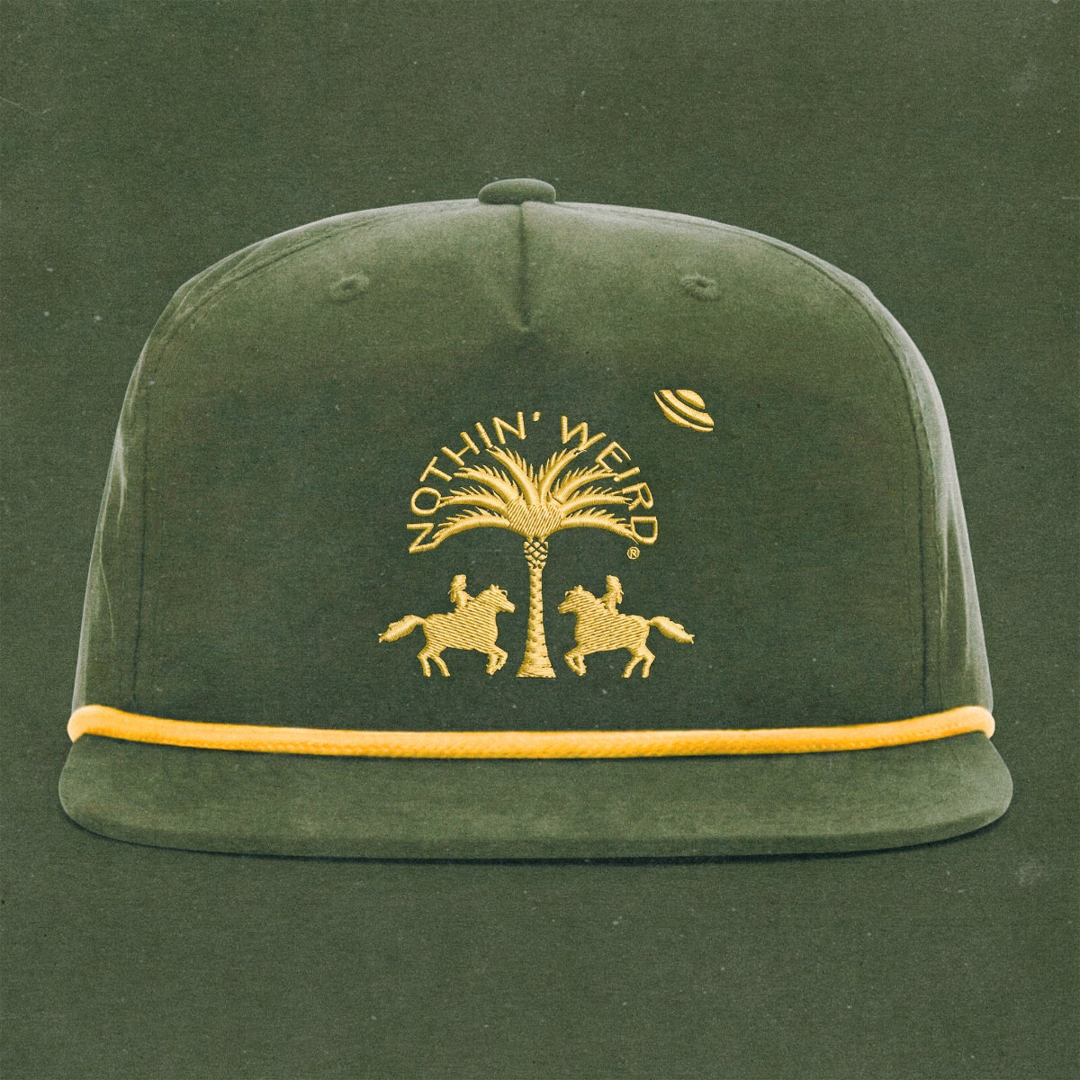 Green and gold ball cap with western horses, palm tree, and ufo stitched on it.