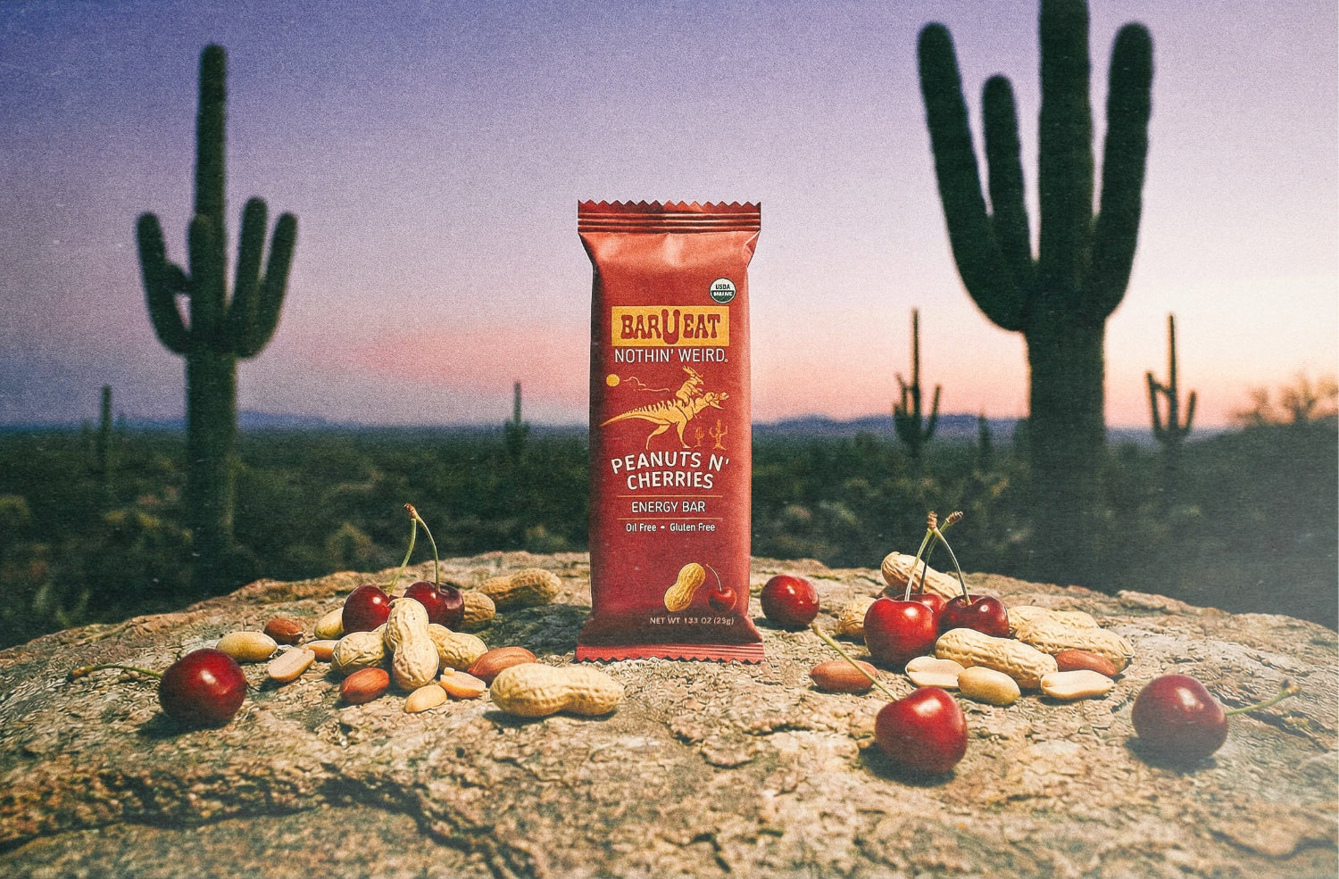 bar u eat peanuts cherry bar with cactus in the background and cherries spread around it