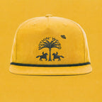 Mustard yellow ball cap with western horses, palm tree, and ufo stitched in black on it.