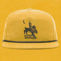 Mustard yellow and black hat with a cowboy riding a bunny rabbit. Funny western hat.