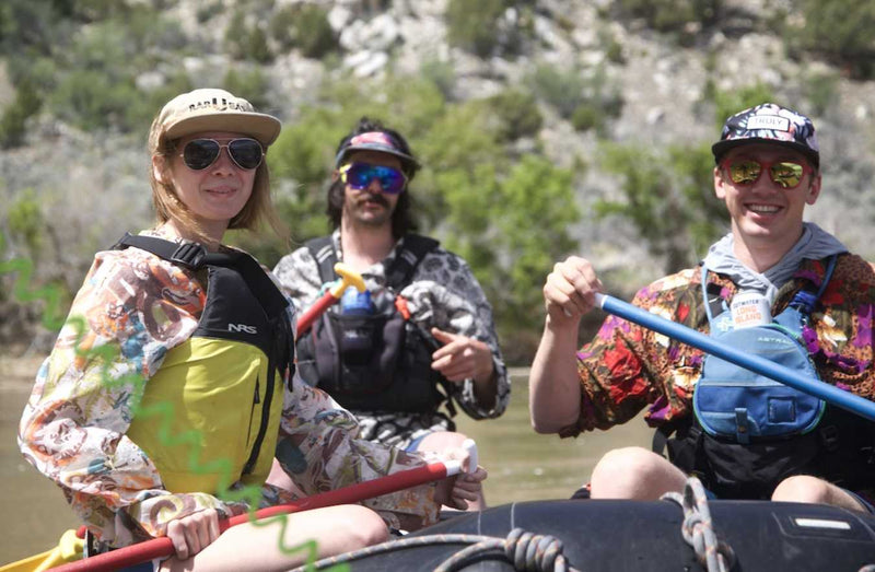 person wearing a bar you eat hat sitting on a raft