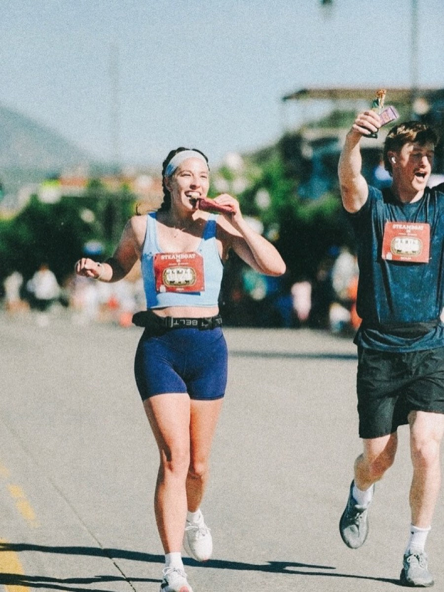 Runners eating Bar U Eat bars mid-race at the Steamboat Marathon
